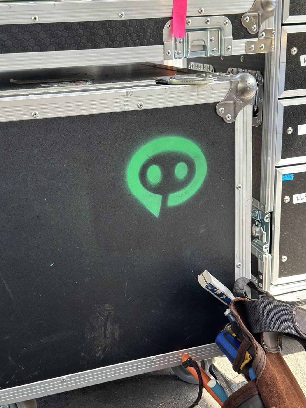 Stagebot logo spray-painted on a road case